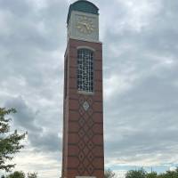 Students posing by the clock tower